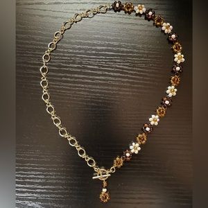 Handmade tricolor, beaded flower necklace. 18in long made with gold chain.